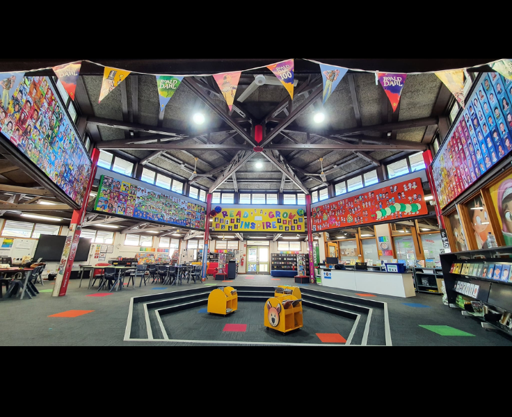 A photo of our Library showcasing children artwork and seating area.