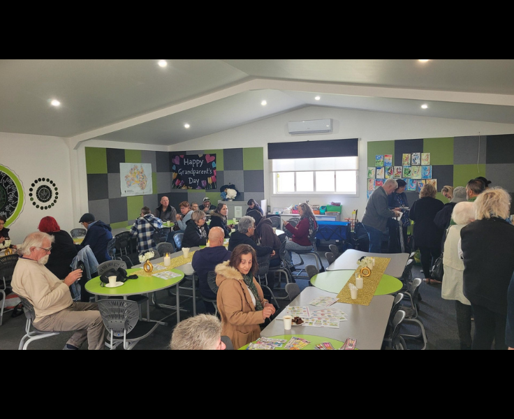 Community learning space has our grandparents enjoying a morning tea around the tables.